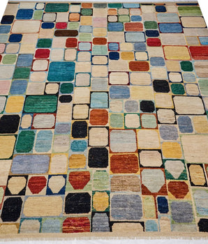 Handwoven Gabbeh Moroccan rug by Orientmattor with intricate geometric patterns in earthy tones, plush and textured surface.