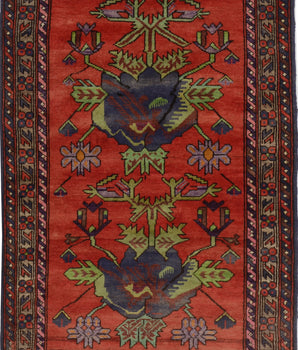 Orientmattor Baluch 64783 classic carpet with intricate geometric patterns in warm tones, detailed close-up of woven textile.