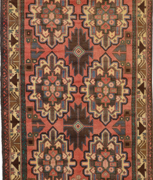 Orientmattor Baluch 64811 classic carpet with intricate traditional patterns and rich colors, displayed on a neutral background.