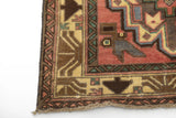 Orientmattor Baluch 64811 classic carpet featuring intricate patterns and rich colors, displayed on a neutral background.