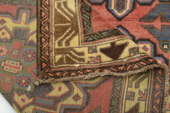 Orientmattor Baluch 64811 classic carpet with intricate traditional patterns in rich, warm colors, showcasing detailed craftsmanship.