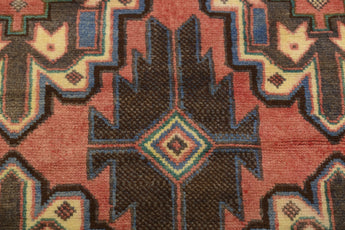 Orientmattor Baluch 64811 classic carpet with intricate geometric patterns in warm tones, showcasing traditional craftsmanship.