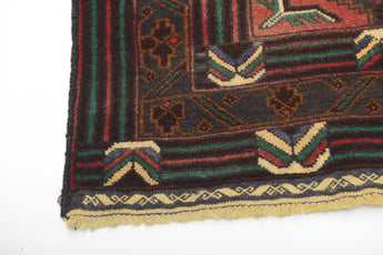 Orientmattor Baluch 64813 classic carpet with intricate patterns in warm tones, detailed close-up of woven textile.