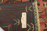 Orientmattor Baluch 64813 classic carpet with intricate geometric patterns and rich colors, displayed on a neutral background.