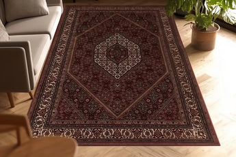 Orientmattor Bidjar 55195 classic carpet on a wooden floor, showcasing intricate patterns and rich colors.