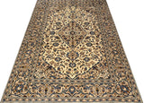 Orientmattor Kashan 61794 classic carpet with intricate floral patterns and warm beige tones, detailed weaving visible.