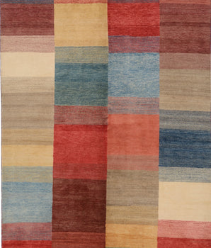 Orientmattor Gabbeh 65015 design carpet with intricate traditional patterns and warm earthy tones, close-up view of woven texture.