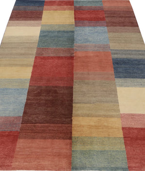 Orientmattor Gabbeh 65015 design carpet with intricate patterns and warm colors, showcasing traditional craftsmanship and textured weave.
