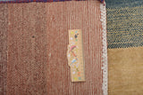 Orientmattor Gabbeh 65015 design carpet with intricate patterns and warm colors, showcasing traditional craftsmanship.