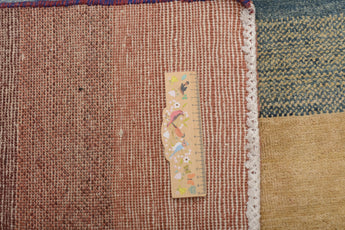 Orientmattor Gabbeh 65015 design carpet with intricate patterns and warm colors, showcasing traditional craftsmanship.