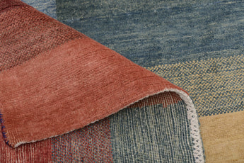 Orientmattor Gabbeh 65015 design carpet featuring intricate geometric patterns in warm earthy tones.