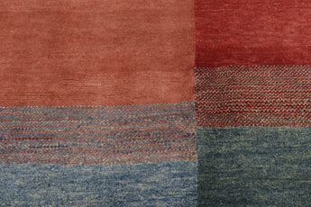 Orientmattor Gabbeh 65015 design carpet with intricate patterns in warm earthy tones, showcasing traditional craftsmanship.
