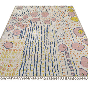 Moroccan design carpet by Orientmattor featuring intricate patterns in warm tones, detailed close-up of woven textile.