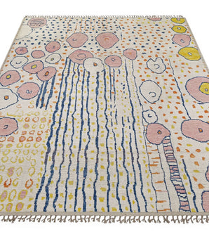 Moroccan design carpet by Orientmattor featuring intricate patterns in warm tones, detailed close-up of woven textile.