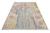 Moroccan design carpet by Orientmattor featuring intricate patterns in warm tones, detailed close-up of woven textile.