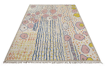 Moroccan design carpet by Orientmattor featuring intricate patterns in warm tones, detailed close-up of woven textile.