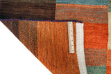 Orientmattor Gabbeh handknuten matta, oriental design, 174x117 cm with intricate patterns and warm colors.