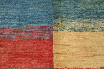 Orientmattor Gabbeh handknuten matta, 237x172 cm, with traditional oriental geometric patterns and warm earthy tones.