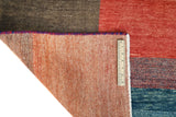 Orientmattor Gabbeh handwoven rug, 296x202 cm with intricate traditional patterns, in warm earthy tones.