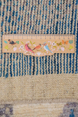 Handwoven Gabbeh Moroccan rug by Orientmattor with intricate geometric patterns in earthy tones.