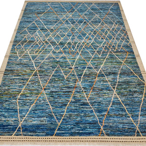 Handwoven Gabbeh rug Moracco No.65989 by Orientmattor, showcasing intricate patterns and warm colors in a close-up shot.