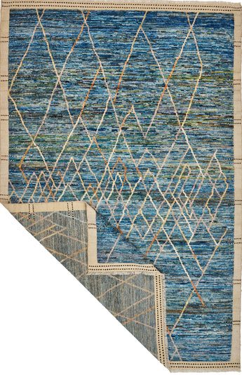 Handwoven Gabbeh Moroccan rug from Orientmattor, featuring traditional geometric patterns and rich earthy tones.