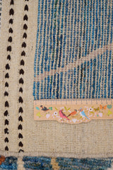 Handwoven Gabbeh rug Moracco No.65989 by Orientmattor, showcasing intricate patterns and rich, earthy colors in natural light.