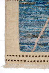 Handwoven Gabbeh Moroccan rug by Orientmattor with intricate geometric patterns in warm earthy tones.