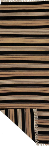 Kelim Dhurrie rug by Orientmattor with intricate geometric patterns in warm earthy tones, woven texture visible in the image.