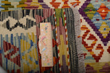 Handwoven Kilim Kelim Chobi rug with intricate geometric patterns, showcasing vibrant colors and detailed craftsmanship.