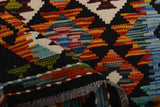 Kilim Chobi rug in living space, geometric wool carpet design