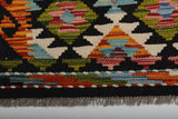 Detailed geometric pattern of Afghan Kilim Chobi wool carpet