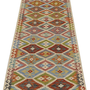 Orientmattor Kelim Chobi 64647 woven rug with geometric patterns, featuring earthy tones and traditional craftsmanship.