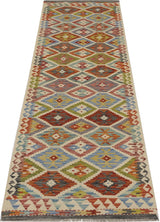Orientmattor Kelim Chobi 64647 woven rug with geometric patterns, featuring earthy tones and traditional craftsmanship.