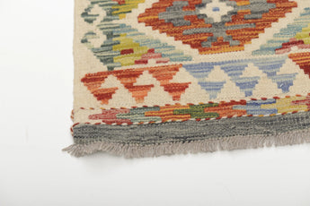 Colorful Orientmattor Kelim Chobi 64647 rug with intricate geometric patterns and vibrant earthy tones, woven in traditional style.