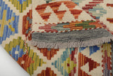 Colorful Orientmattor Kelim Chobi 64647 rug with intricate geometric patterns on a neutral background.
