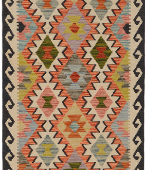 Orientmattor Kelim Chobi 64651 woven rug with geometric patterns and rich earthy tones on a wooden floor.
