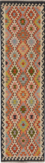 Orientmattor Kelim Chobi 64651 woven rug with geometric patterns and rich earthy tones on a wooden floor.