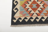 Orientmattor Kelim Chobi rug with intricate geometric patterns and warm earthy tones, showcasing traditional handcrafted design.