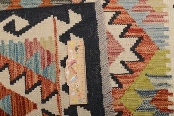 Orientmattor Kelim Chobi rug with intricate geometric patterns and warm earthy tones, showcasing traditional handwoven craftsmanship.