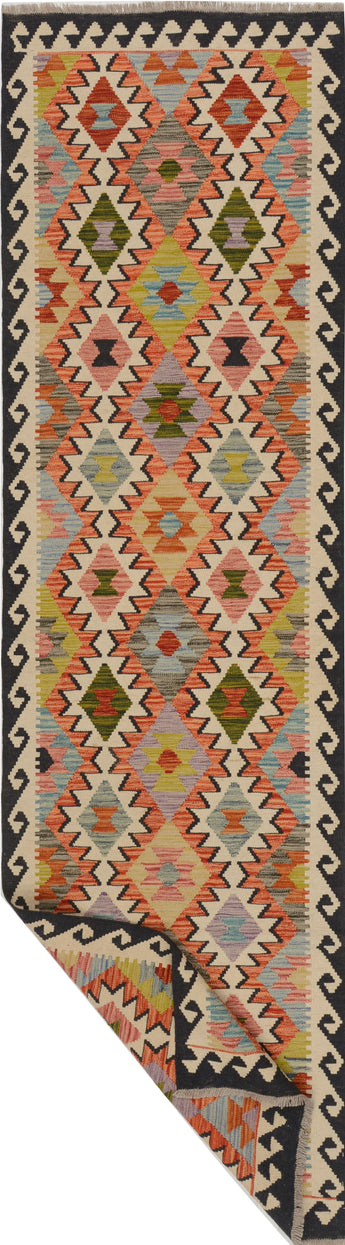 Traditional Kelim Chobi rug featuring intricate geometric patterns in earthy tones, from Orientmattor.