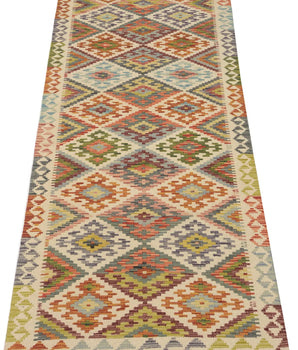 Kelim-Chobi 64660 by Orientmattor featuring intricate patterns and earthy tones in a handwoven textile design.