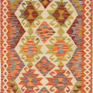 Orientmattor Kelim Chobi rug with intricate geometric patterns in warm earth tones, showcasing traditional handwoven craftsmanship.