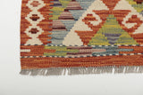Orientmattor Kelim Chobi 64671 rug with intricate geometric patterns, natural earthy tones, handcrafted textile art on the floor.