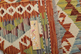 Orientmattor Kelim Chobi 64671 rug with intricate geometric patterns in earthy tones on a woven textile background.