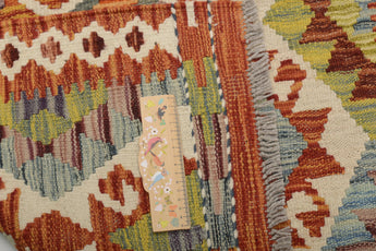 Orientmattor Kelim Chobi 64671 rug with intricate geometric patterns in earthy tones on a woven textile background.