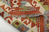 Orientmattor Kelim Chobi 64671 rug with intricate geometric patterns in earthy tones, woven in traditional style.