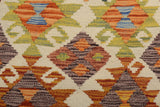 Orientmattor Kelim Chobi rug with intricate geometric patterns and warm earthy tones, showcasing traditional handcrafted design.