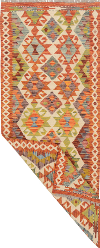 Colorful Orientmattor Kelim Chobi rug with intricate geometric patterns and warm earthy tones, woven with traditional craftsmanship.