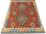 Orientmattor Kelim Chobi 64683 rug with traditional geometric patterns and warm earthy tones, woven textile for home decor.